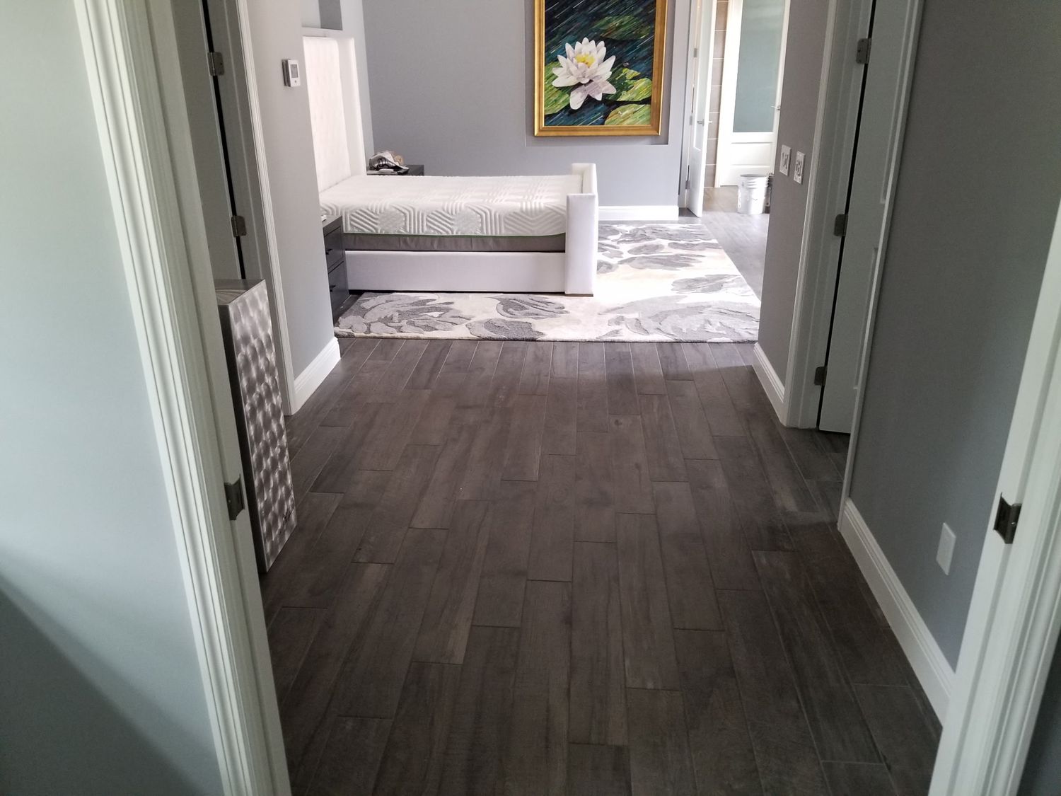 Dark plank flooring hallway by Stephen Wade Gibson Flooring, Central Florida