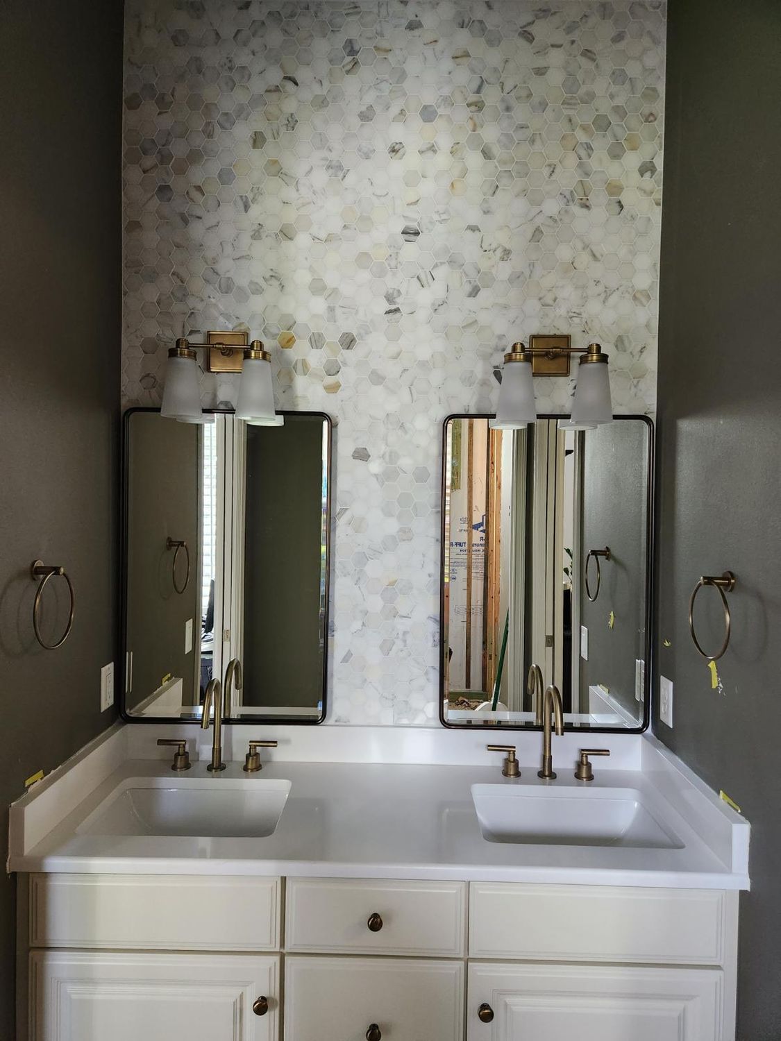Double vanity mosaic feature wall by Stephen Wade Gibson Flooring, Central Florida
