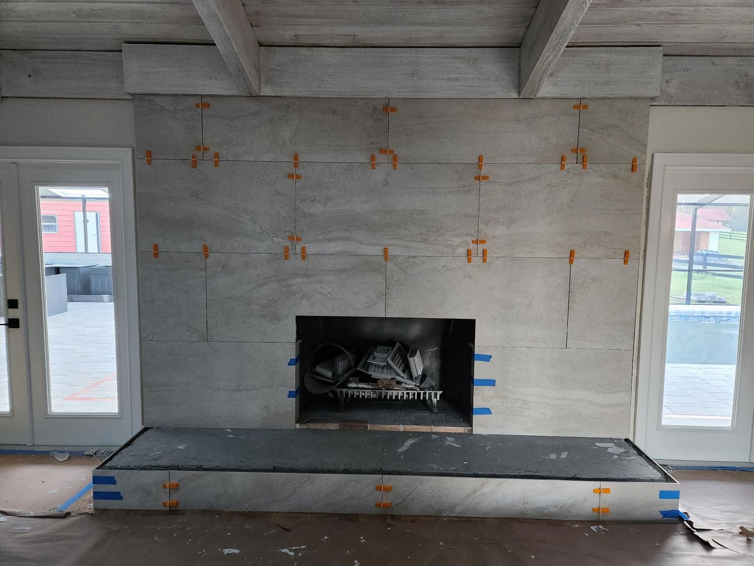 Fireplace surround large format tile by Stephen Wade Gibson Flooring, Central Florida