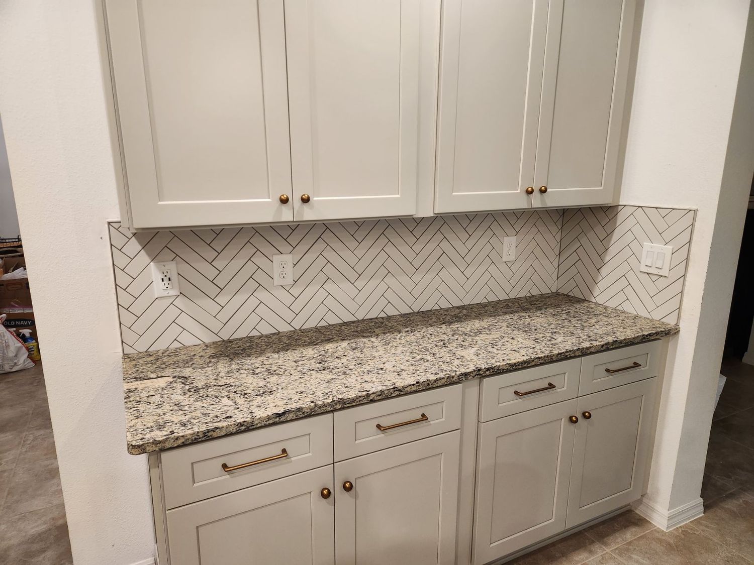 Herringbone marble backsplash by Stephen Wade Gibson Flooring, Central Florida