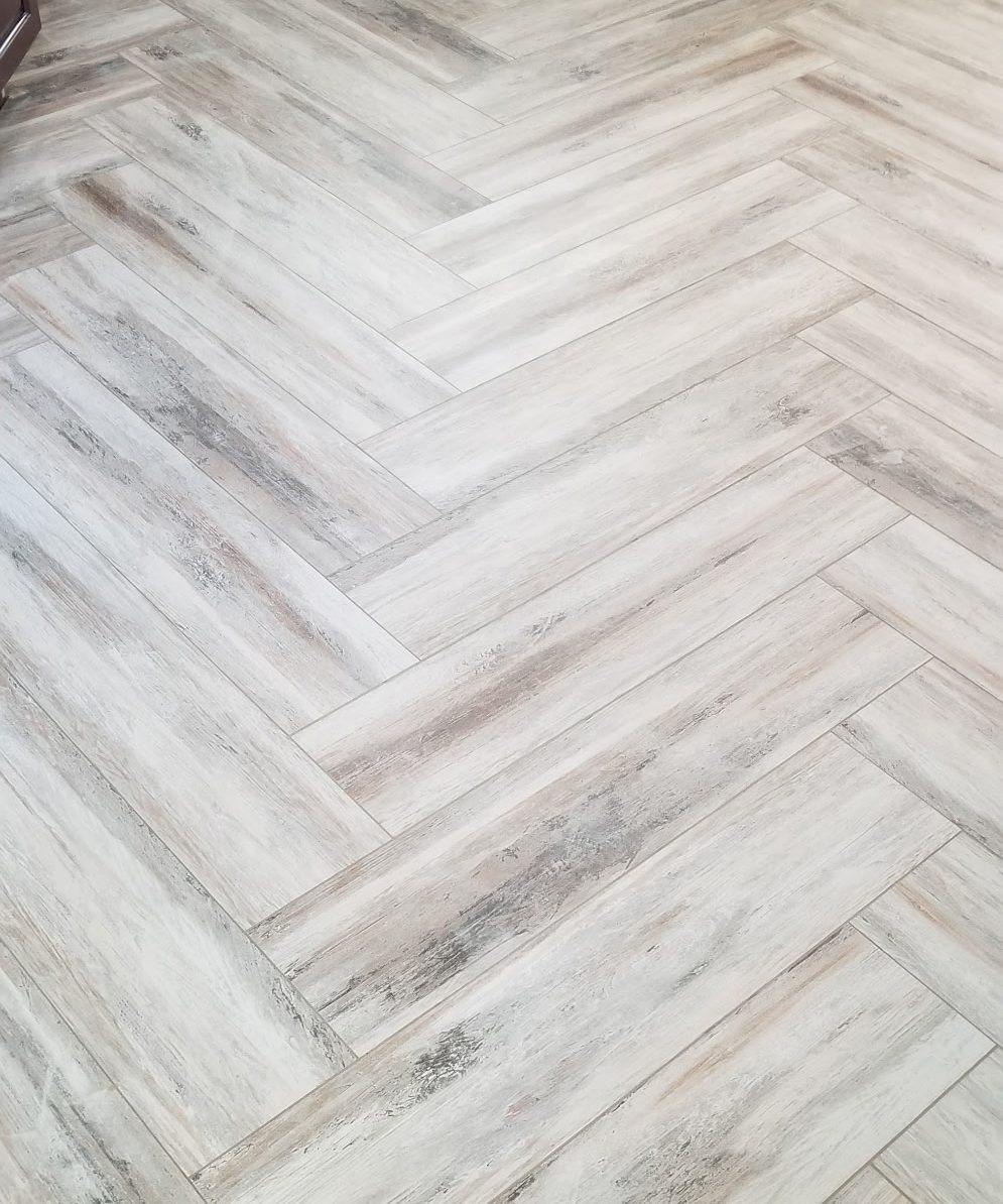 Herringbone wood-look plank flooring