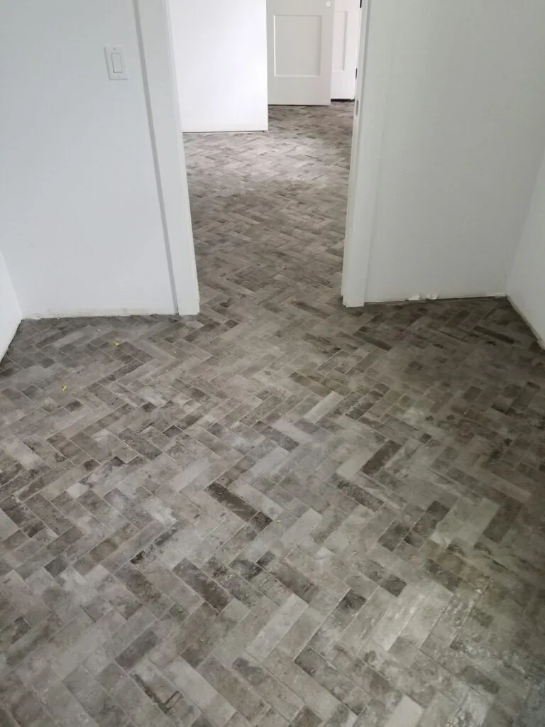 Herringbone wood-look tile floor