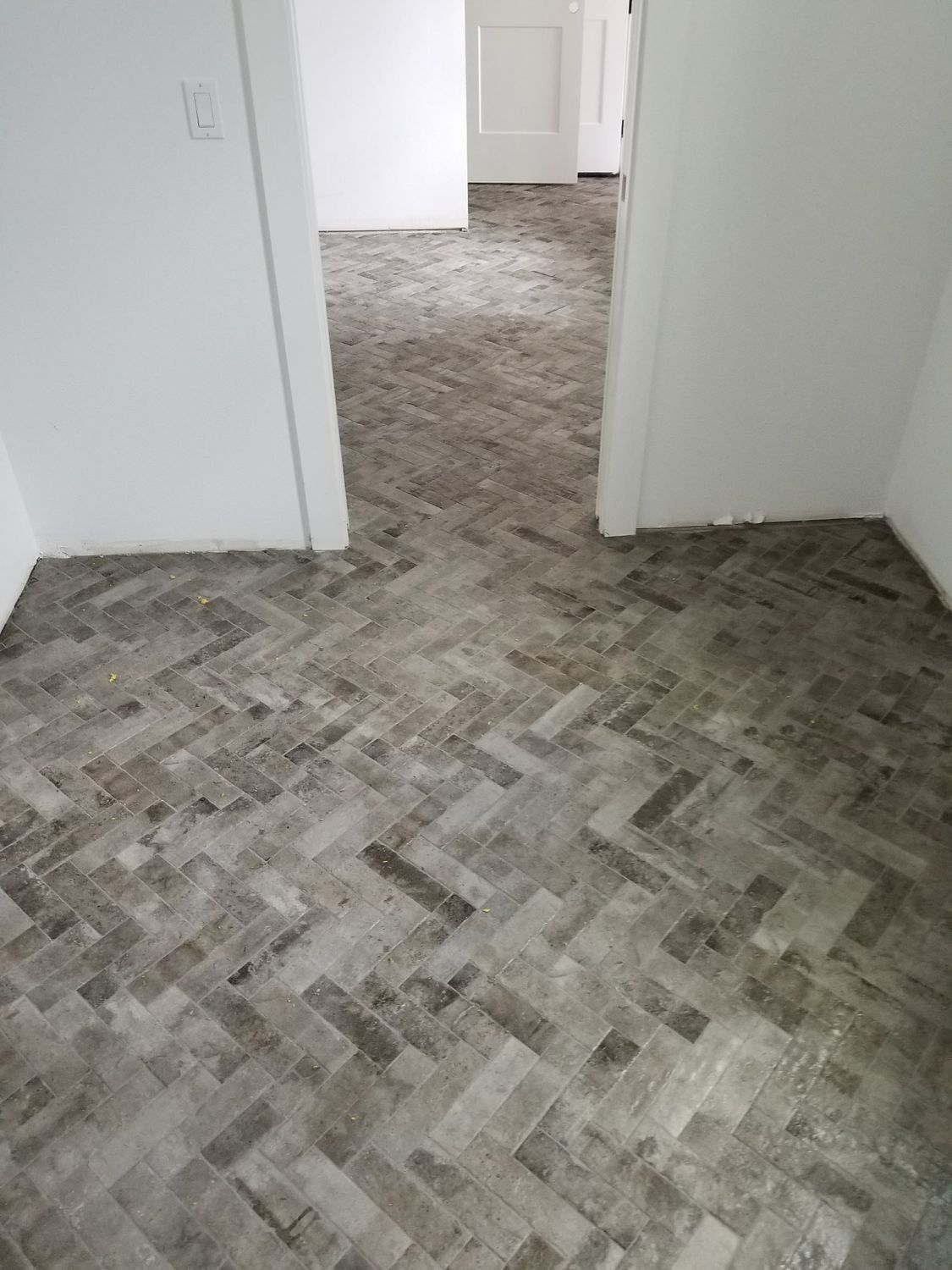 Herringbone wood look tile floor by Stephen Wade Gibson Flooring, Central Florida
