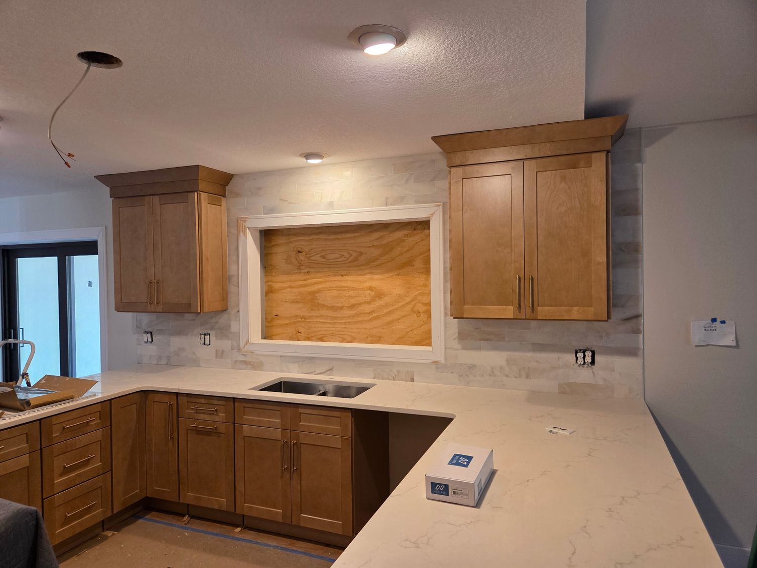 Kitchen backsplash white cabinets by Stephen Wade Gibson Flooring, Central Florida