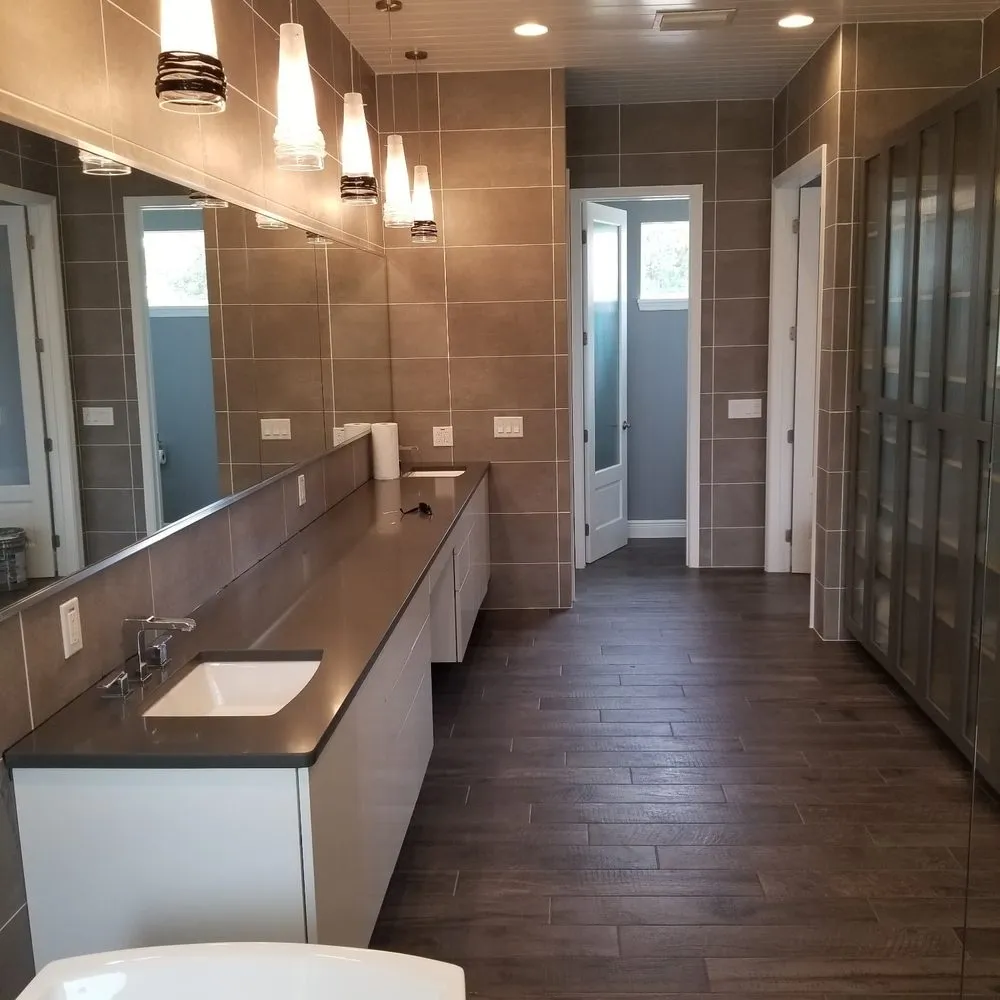 Master bathroom with tiled feature wall and vanity