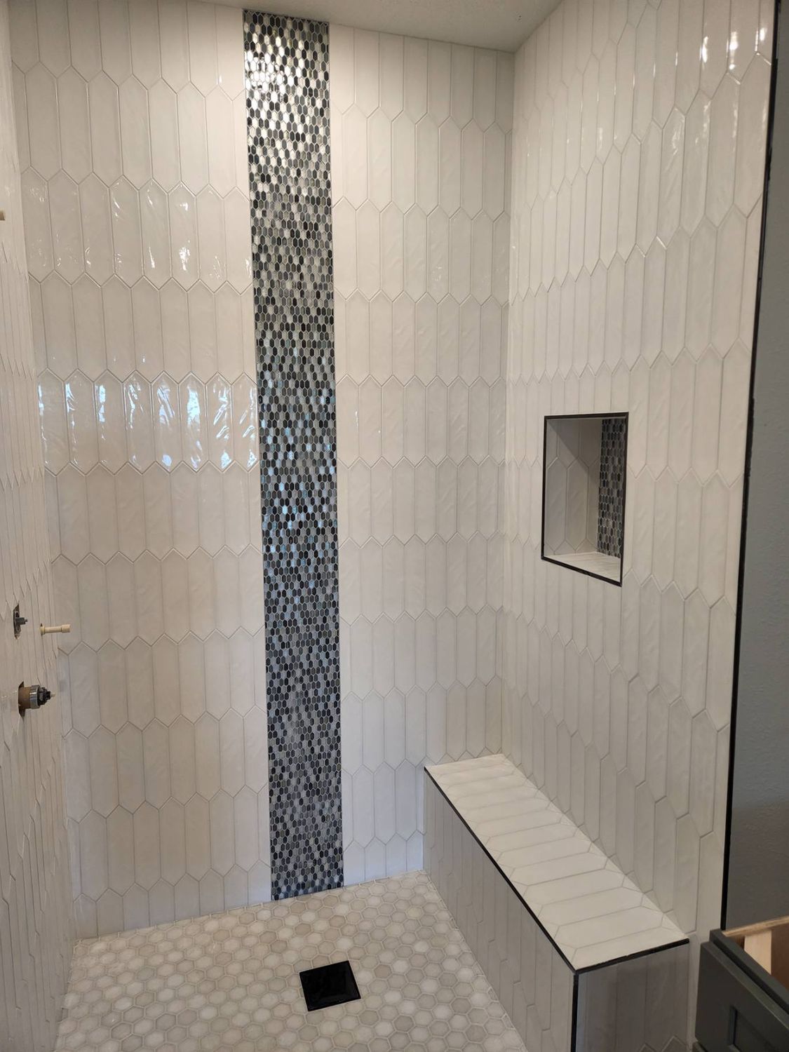 Shower mosaic inlay bench by Stephen Wade Gibson Flooring, Central Florida