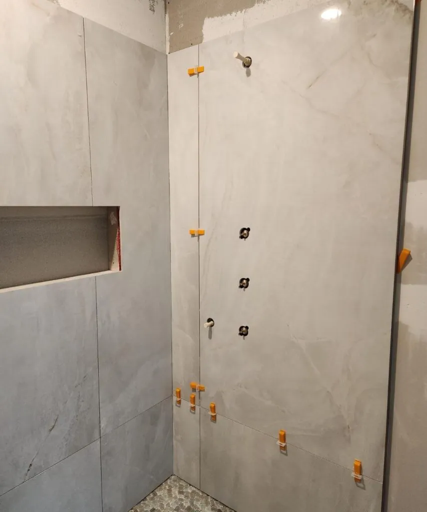 Shower tile repair in progress