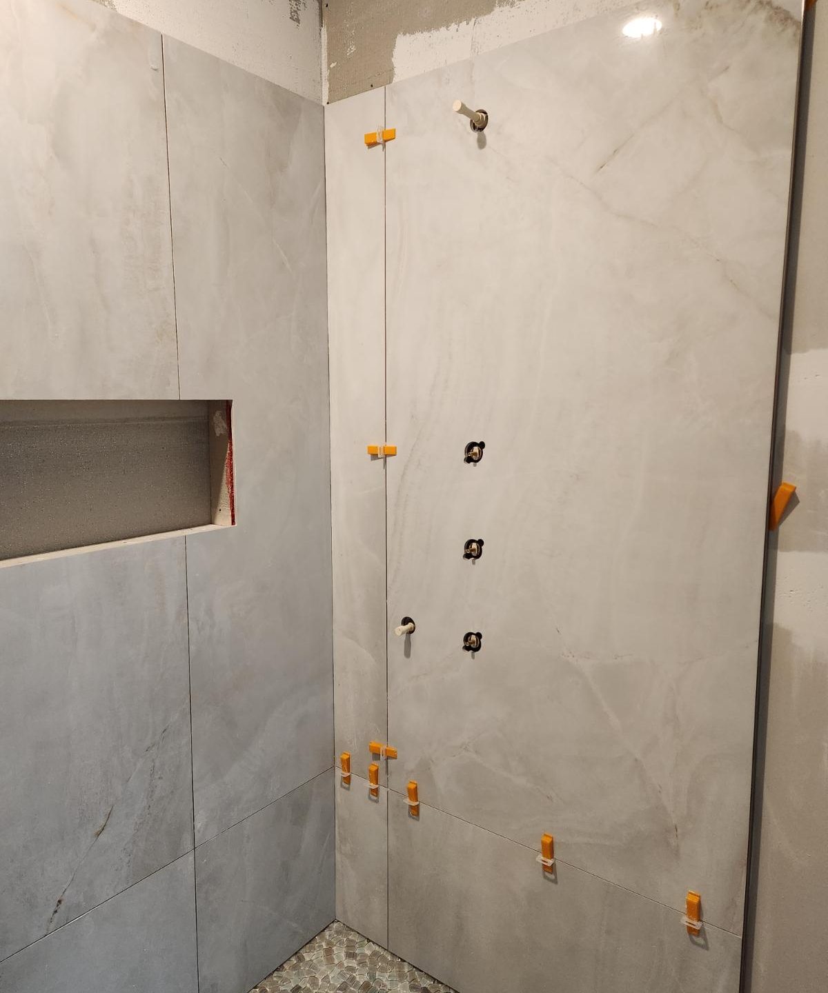 Shower tile repair in progress