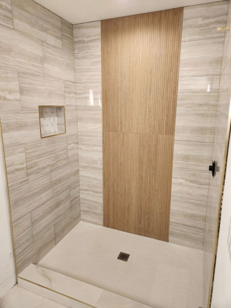 Shower wood look accent panel by Stephen Wade Gibson Flooring, Central Florida