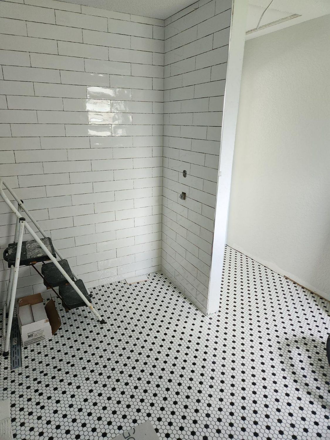 Subway shower mosaic floor by Stephen Wade Gibson Flooring, Central Florida