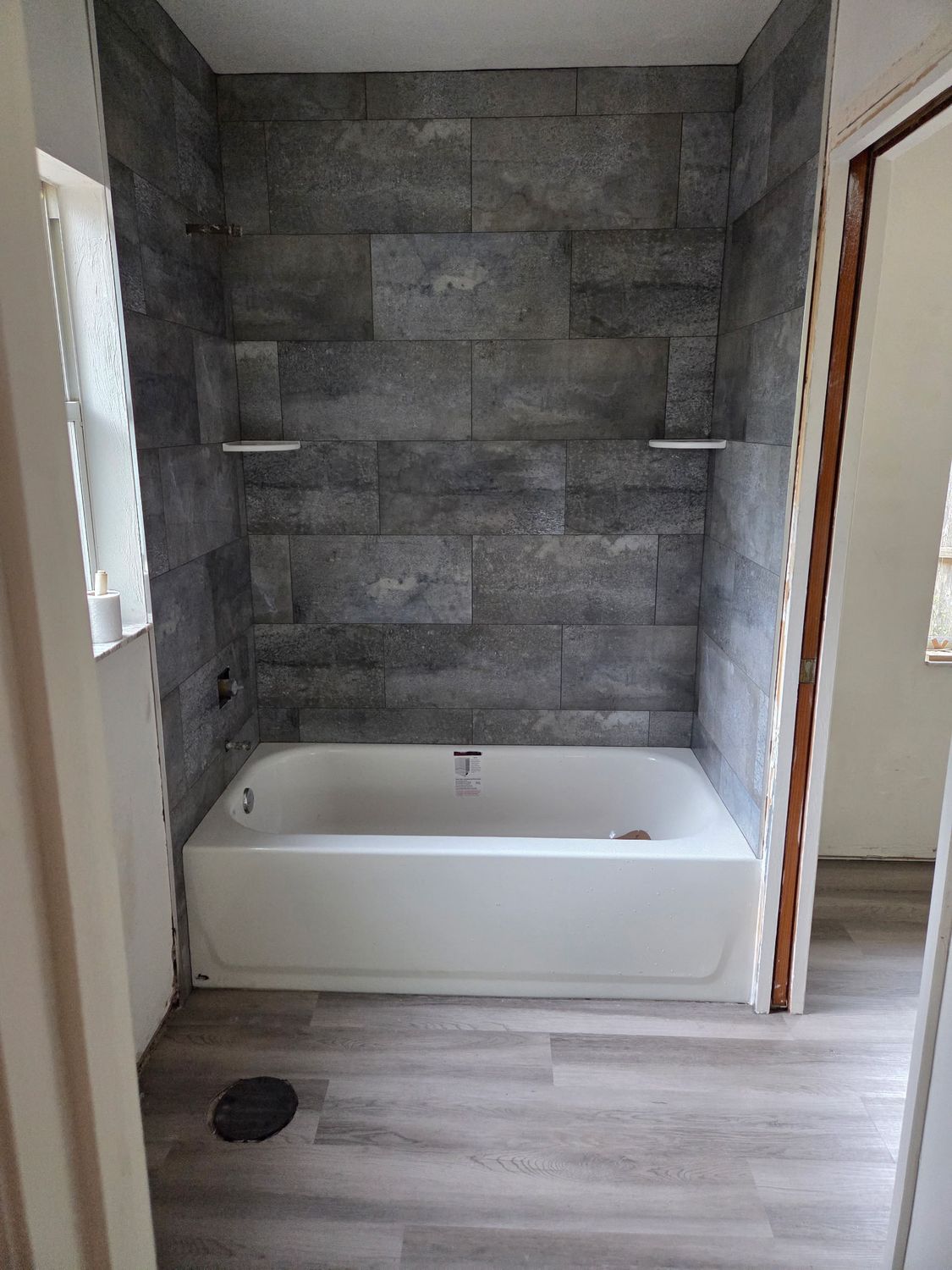 Tub surround grey stone tile by Stephen Wade Gibson Flooring, Central Florida